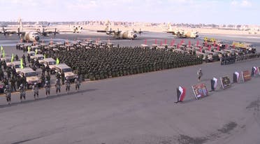 Members of the Egyptian Armed Forces stand next to military vehicles and planes. (Facebook/EgyArmySpox)