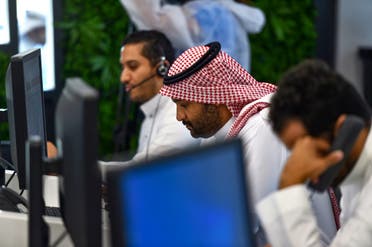 Employees work at the Saudi National Health Emergency Operations Center in the capital Riyadh on May 3, 2020. (AFP)