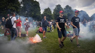 Protesters burn flares as they gather at the city’s central Malieveld grounds to demonstrate in The Hague on June 21, 2020. (AFP)