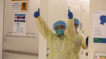 A member of medical staff wearing protective equipment gestures while entering the intensive care unit amid the coronavirus outbreak, at the Cleveland Clinic hospital in Abu Dhabi, United Arab Emirates, April 20, 2020. (Reuters)