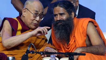 Tibetan spiritual leader the Dalai Lama, left, and Yoga Guru Baba Ramdev in Mumbai, India August 13, 2017. (Reuters)
