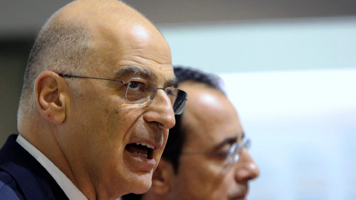 Greece's foreign minister Nikos Dendias, left, and his Cypriot counterpart Nicos Christodoulides talk to the media in Nicosia, Cyprus in October 2019. (AP)