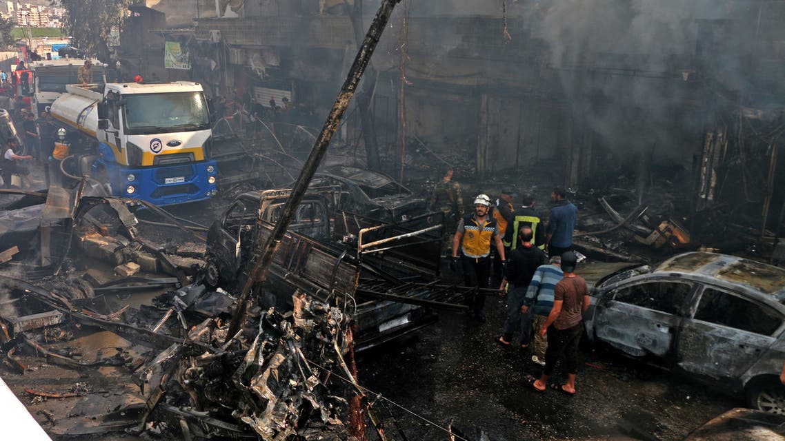 A handout picture released by the Syrian Civil Defence rescue workers, also known as White Helmets, shows the scene of a fuel truck bomb which killed 36 people including at least six Turkey-backed rebel fighters on April 28, 2020 in the northern Syrian city of Afrin, controlled by Ankara's proxies.