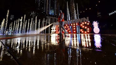 A municipal worker disinfects the streets as a preventive measure against the spread of COVID-19 (novel cornavirus) in downtown Dubai. (File photo: AFP)
