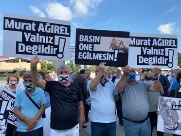People hold placards that read  Murat Agirel is not alone  and  we want justice for Murat  outside the courthouse, in Istanbul, Wednesday, June 24, 2020. (AP)