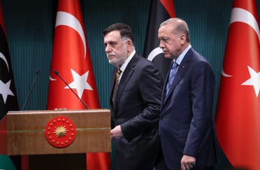 Turkish President Recep Tayyip Erdogan (R) and Libyan GNA leader Fayez al-Sarraj (L) arrive for a joint press conference in Ankara on June 4, 2020. (AFP)