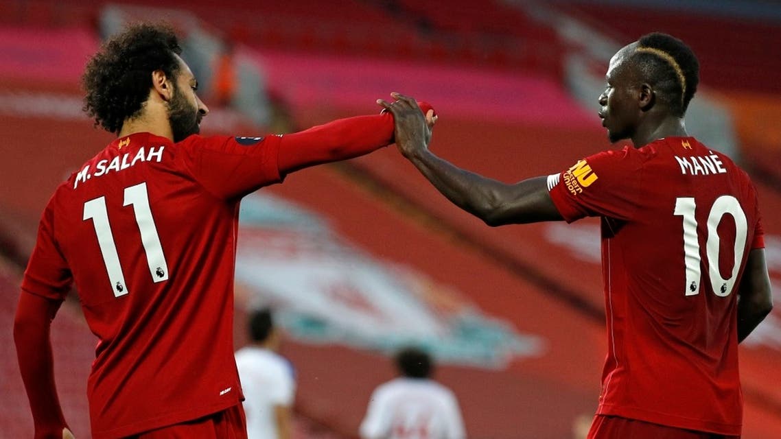 Mohamed Salah (L) and Sadio Mane (R) celebrate during a match, June 24, 2020. (AFP)