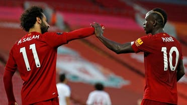 Mohamed Salah (L) and Sadio Mane (R) celebrate during a match, June 24, 2020. (AFP)