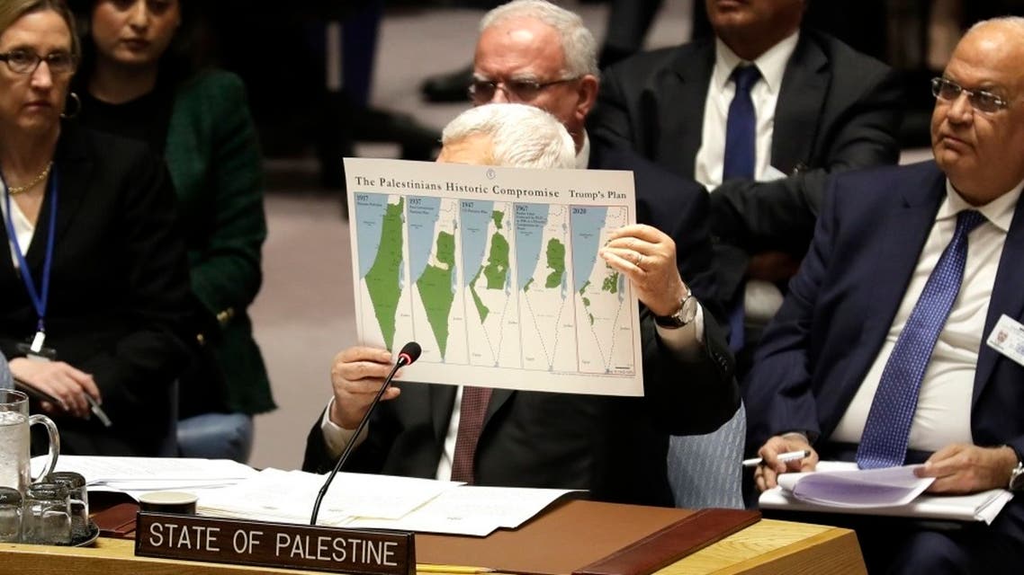 Palestinian President Mahmoud Abbas holds up a document as he speaks during a Security Council meeting at UN headquarters. (File photo: AP)