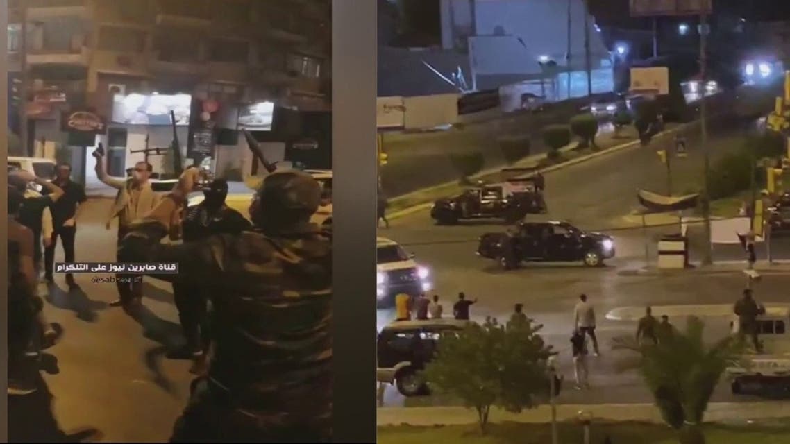 Several Katai'b Hezbollah militiamen carrying weapons took to the streets following overnight raids and arrests. (Screengrab)