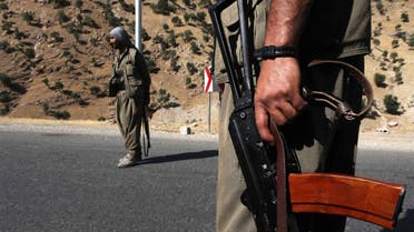 Members of the Kurdistan Workers' Party (PKK) carry rifles as they stand guard on a road in the Qandil Mountains, the PKK headquarters in northern Iraq. (File photo)