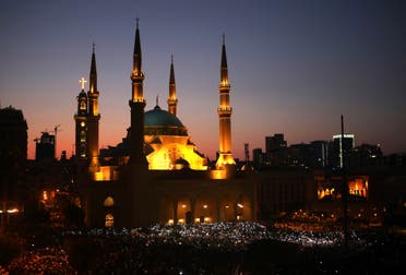 A mass rally outside the Mohammad al-Amin mosque and the nearby Maronite Cathedral of St George in the downtown district of Beirut's Martyr's Square, Lebanon.(AFP)