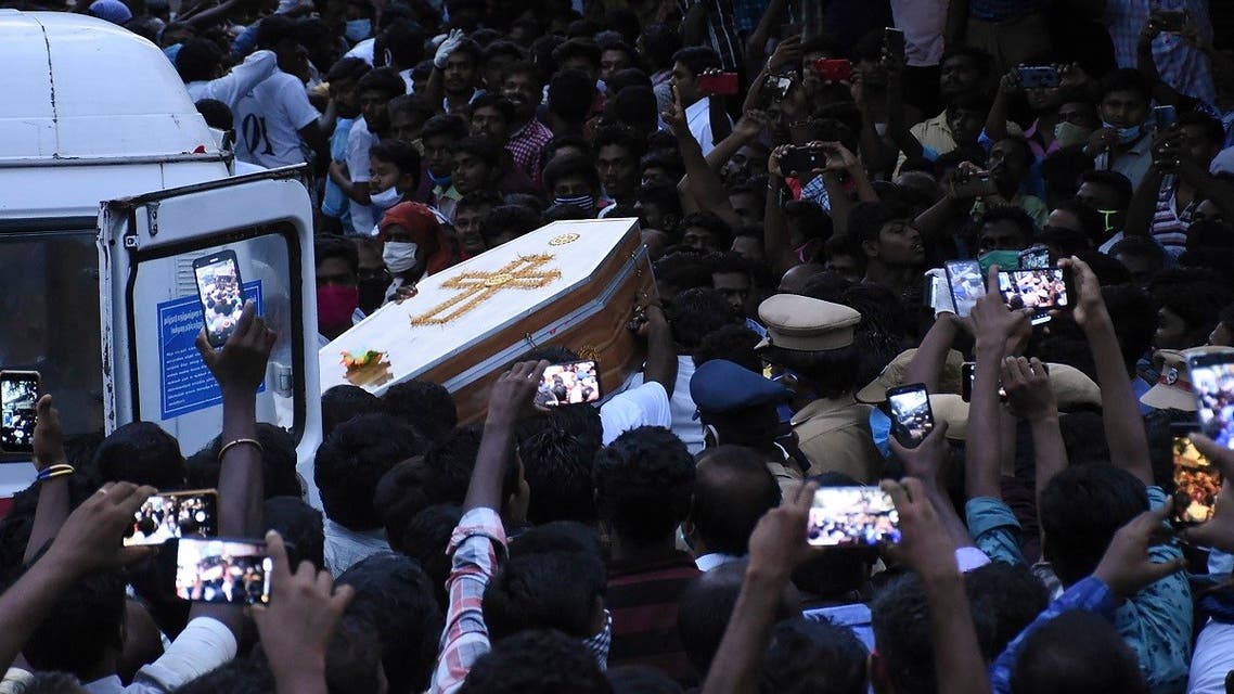 In this picture taken on June 26, 2020, residents gather as they carry the coffin of Jayaraj, 58, and son Bennicks Immanuel, 31, allegedly tortured at the hands of police in Sathankulam, Thoothukudi district in the Indian state of Tamil Nadu. (AFP)