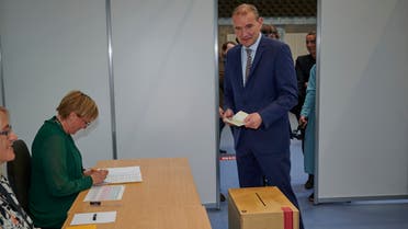 Sitting President of Iceland, Gudni Th Johannesson (L) arrives to cast his vote at the polling station 'Altanesskoli' in Gardabaer, Iceland on June 27, 2020. 