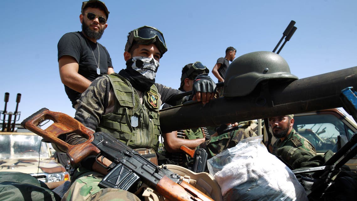 Members of the self-proclaimed eastern Libyan National Army (LNA) special forces gather in the city of Benghazi, on their way to reportedly back up fellow LNA fighters on the frontline west of the city of Sirte, facing forces loyal to the UN-recognised Government of National Accord (GNA), on June 18, 2020. The resurgent GNA has vowed to push on for Sirte, late Libyan leader Moamer Kadhafi's hometown and the last major settlement before the traditional boundary between western Libya and strongman Khalifa Haftar's stronghold in the east.