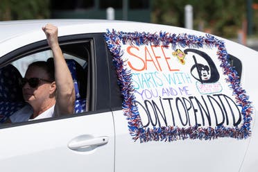 Disney cast members stage a car caravan outside Disneyland California, calling for higher safety standards for Disneyland to reopen. (Reuters)