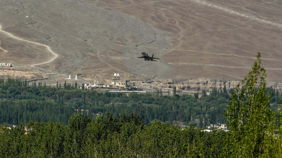 An Indian Air Force aircraft is seen against the backdrop of mountains surrounding Leh, the joint capital of the union territory of Ladakh, on June 27, 2020. India acknowledged for the first time on June 25 that it has matched China in massing troops at their contested Himalayan border region after a deadly clash this month.