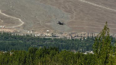 An Indian Air Force aircraft is seen against the backdrop of mountains surrounding Leh, the joint capital of the union territory of Ladakh, on June 27, 2020. India acknowledged for the first time on June 25 that it has matched China in massing troops at their contested Himalayan border region after a deadly clash this month.