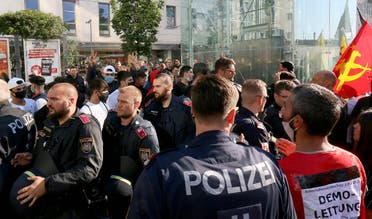 Police separate Kurds and Turkish demonstrators during a Kurdish demonstration against Turks in Vienna, Austria, Saturday, June 27, 2020. (AP)