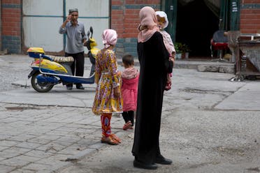A Uighur woman wears a full length garment and headscarf in the city of Aksu in western China's Xinjiang province. (AP)