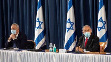 Israeli Prime Minister Benjamin Netanyahu and Israeli Defense Minister Benny Gantz attend the weekly cabinet meeting at the Ministry of Foreign Affairs in Jerusalem, June 14, 2020. (Reuters)