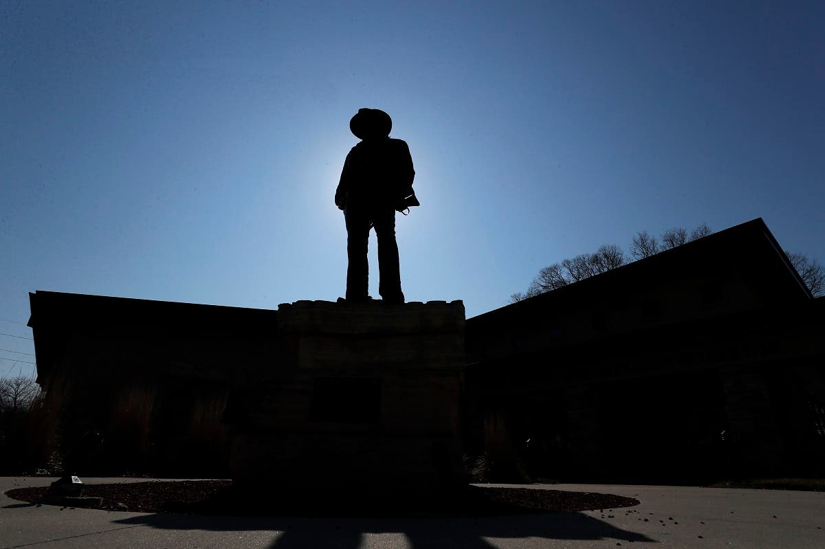 A statue of actor John Wayne is seen in front of the John Wayne Birthplace Museum, on April 1, 2020, in Winterset, Iowa. (AP)