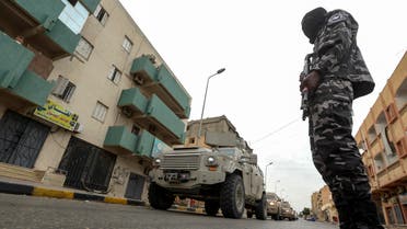 A member of security forces affiliated with the Libyan Government of National Accord (GNA)'s Interior Ministry stands as a security patrol advances in the town of Tarhuna, about 65 kilometres southeast of the capital Tripoli on June 11, 2020. 