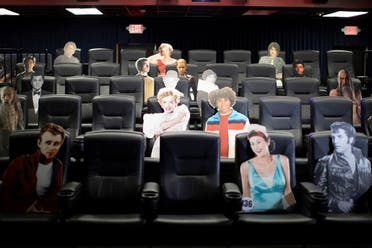 Seats are spaced by cardboards of movie characters aimed at social distancing ahead of the reopening of the Arena Cinelounge theatre during the coronavirus outbreak in Los Angeles, California, June 17, 2020. (Reuters)