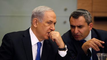 A file photo of Netanyahu (L) listens Zeev Elkin during a committee meeting at parliament in Jerusalem June 2, 2014. (Reuters)