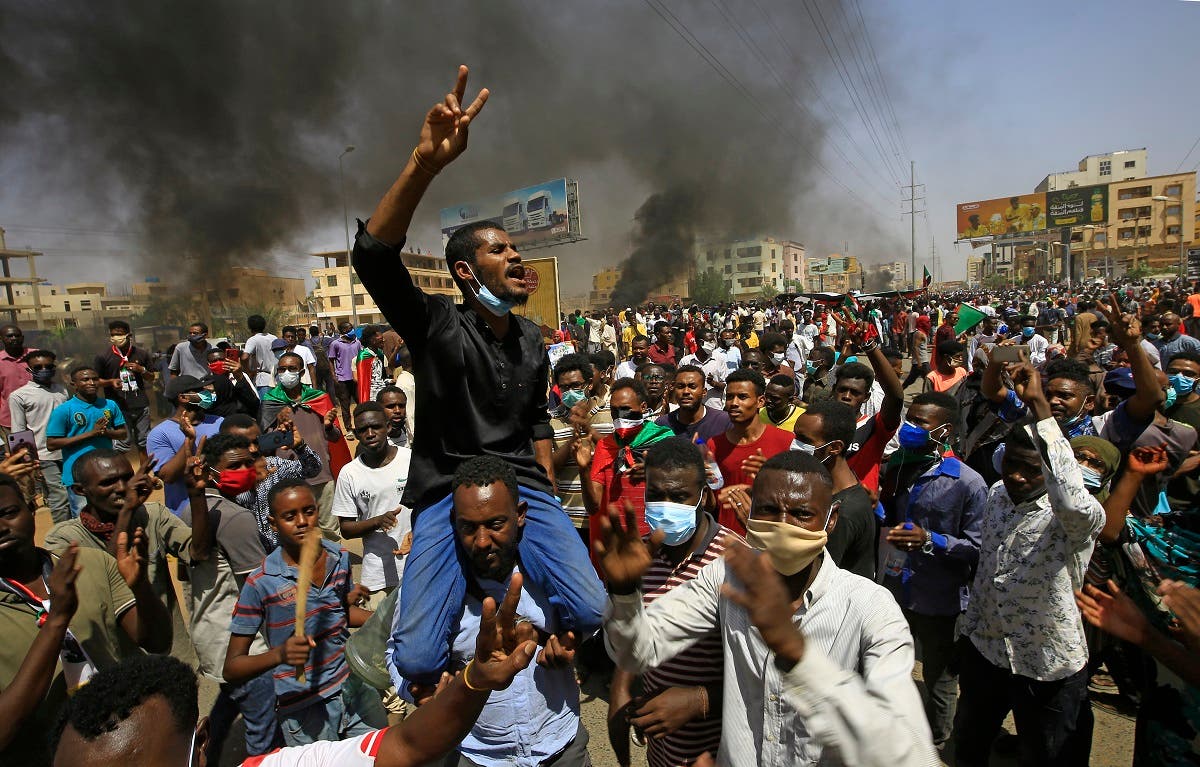 Sudanese demonstrators gesture as they chant during a protest on Sixty street in the east of the capital Khartoum, on June 30, 2020. (AFP)