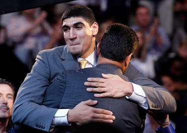 Enes Kanter hugs his father after being selected in the 2011 NBA Draft in Newark, New Jersey on June 23, 2011. (Reuters)
