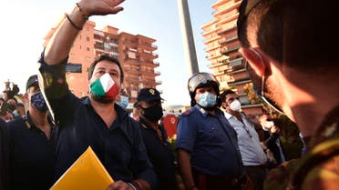 Far-right League (Lega) party leader Matteo Salvini (C) gestures in front of a block of flats where 43 positive cases of coronavirus have been identified, and where tensions flared over a cluster of coronavirus cases among Bulgarian farm workers, fueling tension with locals in Mondragone, north of Naples, on June 29, 2020. (AFP)