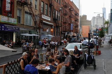 People eat outside during part of the phase 2 reopening in New York City, June 27, 2020. (Reuters)