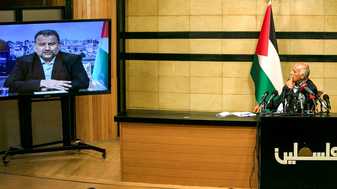 Senior Fatah official Jibril Rajoub, in the West Bank city of Ramallah, attends by video conference a meeting with deputy Hamas chief Saleh Arouri (on screen from Beirut) discussing Israel's plan to annex parts of the Israeli-occupied West Bank, on July 2, 2020.