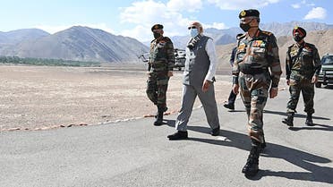 Indian Press Information Bureau (PIB), India's Prime Minister Narendra Modi (C) walks with military commanders as he arrives in Leh, the joint capital of the union territory of Ladakh. (AFP)