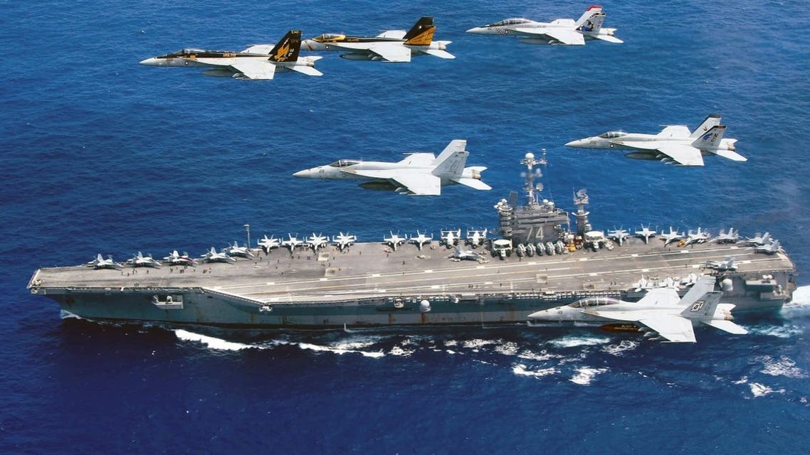 This photo taken on June 18, 2016 and released June 19, 2016 by the US Navy shows a flight formation of Boeing F/A-18E and F Super Hornets from Carrier Air Wing (CVW) 5 and 9 above the Nimitz-class aircraft carrier USS John C. Stennis (CVN-74) in the Philippine Sea. (AFP)