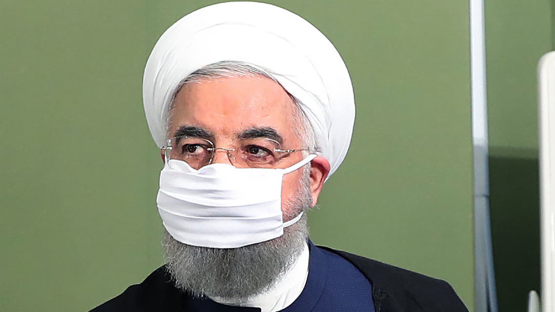 A handout picture made available by the Iranian presidency on July 4, 2020, shows Iran's President Hassan Rouhani wearing a face mask as he attends a cabinet session in the capital Tehran.