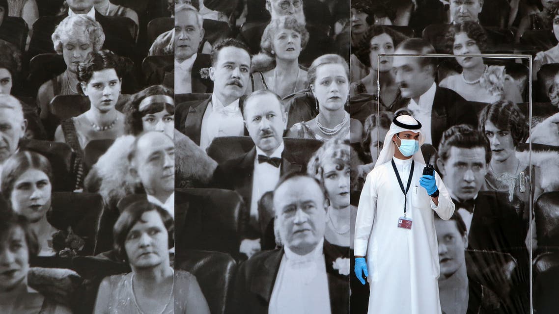 A Kuwaiti member of staff uses a walkie-talkie at the re-opened 360 Mall in the capital Kuwait City, on July 1, 2020, after 110 days of shutdown to prevent the spread of the novel coronavirus in the country.