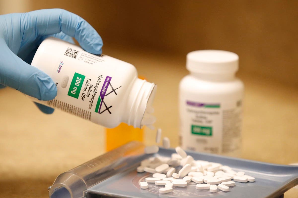 A pharmacy tech pours out pills of Hydroxychloroquine at Rock Canyon Pharmacy in Provo, Utah. (AFP)