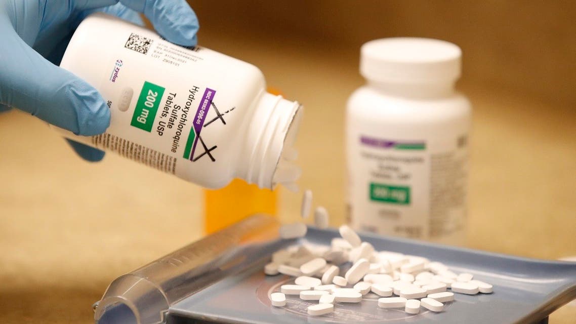 A pharmacy tech pours out pills of Hydroxychloroquine at Rock Canyon Pharmacy in Provo, Utah. (AFP)
