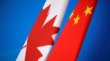 Flags of Canada and China are placed for the first China-Canada economic and financial strategy dialogue in Beijing, China, November 12, 2018. REUTERS