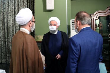 Iranian President Hassan Rouhani is seen wearing a face mask during a meeting, in Tehran. (Reuters)