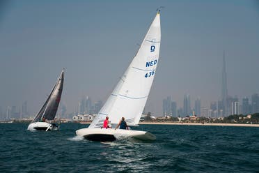 Sailboats taking part in a race catch the wind with the Burj Khalifa, the world's tallest building, seen in the distance in Dubai, United Arab Emirates, Friday, June 19, 2020. (AP)