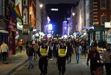 Police on patrol as people gather in Soho, as restrictions are eased following the outbreak of the coronavirus disease (COVID-19), in London, Britain. (Reuters)