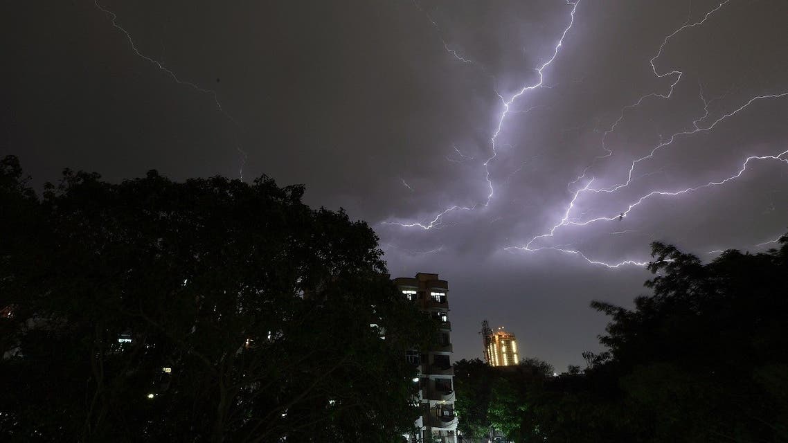 Lightning strikes over residential apartments during a thunderstorm on the outskirts of the Indian capital New Delhi on May 2, 2018. (AFP)