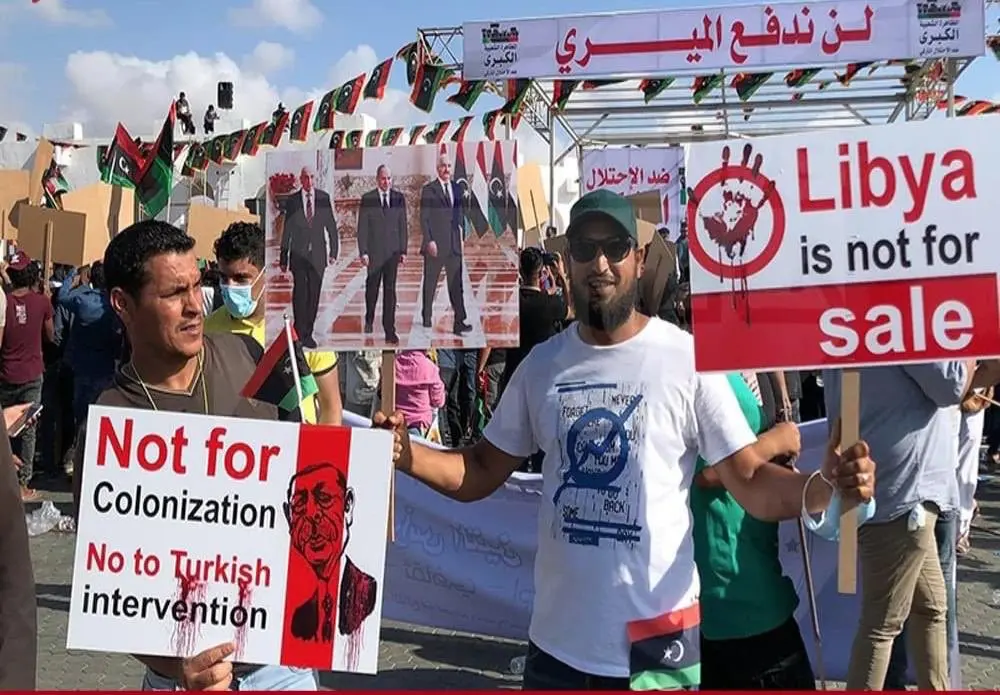 Libyan protesters holding signs saying Libya is not for colonization in Benghazi, June 5, 2020. (Al Arabiya)