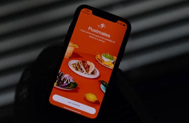 This file illustration photo taken on June 30, 2020 shows the logo of delivery app Postmates on a smartphone screen in Los Angeles. (AFP)