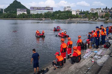 Rescuers search for survivors after a bus plunged into a lake in Anshun in China’s southwestern Guizhou province on July 7, 2020. (AFP)
