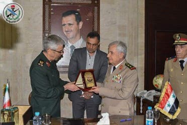 Iranian Armed Forces Chief of Staff Major General Mohammad Bagheri (L) and Syria's Defense Minister Ali Ayoub signing a bilateral military deal in the capital Damascus. (AFP)