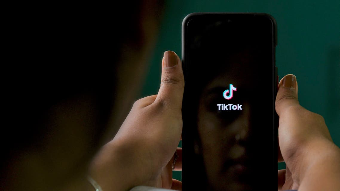 An Indian mobile user browses through the Chinese owned video-sharing 'Tik Tok' app on a smartphone in Bangalore on June 30, 2020. TikTok on June 30 denied sharing information on Indian users with the Chinese government, after New Delhi banned the wildly popular app citing national security and privacy concerns.